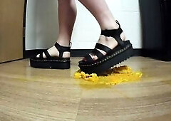 Crushing oranges in Platform Sandals
