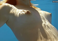 Small tits blonde babe Sofie Otis swimming naked