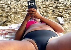 Squirting on the beach with the fisherman watching and thoroughly enjoying it.