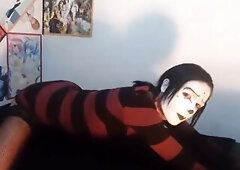 Gothic femboy in constricted costume and underware shows off her booty