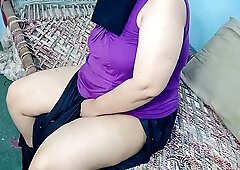 Pakistani BBW enjoys titjob and fingering on a patterned couch at home