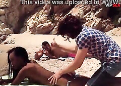 Topless Black Sweetheart Oiled Up on the Beach... His Hands Slip Beneath Her Bikini