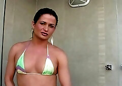 Attractive Brazilian shemale Perlla wanks her cock in the shower