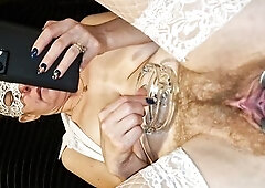 I'm watching porn and smokin' a cigarette during the time that the cameraman looks into my gaping cunt