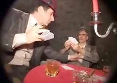 Red curly haired mature hooker works on several cocks at once