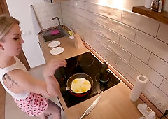 Kitchen encounter escalates with a footjob and ends in a cumshot cascade