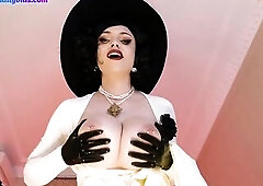 Lady Dimitrescu is playing with her giant milk jugs previous to having anal sex with her lover