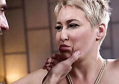 Fastened on shoulders with hands bound up behind back and legs up gagged golden-haired aged lady Ryan Keely gets whipped then bent over banged by task