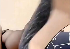 Cumming on her cellphone