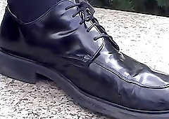 Stud removes shoes and socks to show bare feet