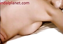 Jamie Lee Curtis bangs with a chap in couch, 1st on her back and then lying on her belly as the dude has sex with her from behind.