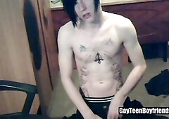 Tattood twunk plays with his big uncircumcised cock