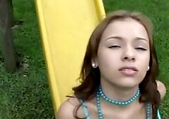 Selina 18 playing at playground like seesaw slide etc until get horny. She fingering hard and exposed her natural tits