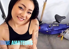 Sensual busty Asian brunette rides on a pretty long pole