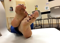 Naughty Teaches In Blue Jeans Showcasing Her Soles In The