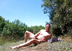Muscled Exhibitionist jerking at a park