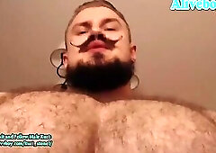 Guy with a nice beard shows off his hot body in front of the camera