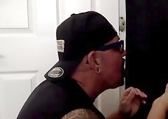 Amateur DILF eagerly gulps down his boyfriend's cock through a homemade gloryhole