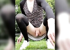 Annemieke pissing on a public parkinglot wearing suit and white sneakers. Walking around and fingering my booty in the park.