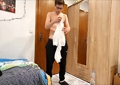 Teen gives himself a handjob in white socks while sitting on a chair