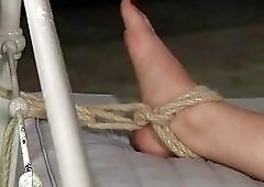 Slutty slave tied up to a bed and whipped BDSM