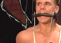 Bondage session with muscular hunk with pins in his chest