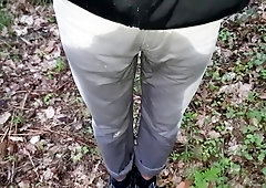 Peeing my grey jeans in the woods