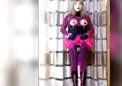 Sissy Monique is clothed all in pink with a female mask. Her schlong is in a chastity strap and there's a anal intercourse in her butt. That babe