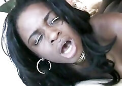 Ebony guy with a massive dick pounds curvy black's booty in couch and fills her throat with sperm.