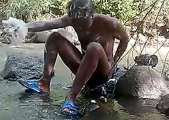 XXL black manmeat boy getting off while taking a bathroom outdoors and shooting huge flow