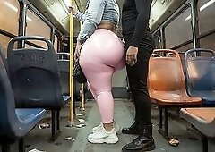 This thick masked big beautiful woman looks highly sexy in her shiny pink leggings on the public bus. Her partner can't keep his hands off her bi