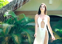 Irina Sivalna is posing naked next to the swimming pool, in the middle of the day