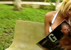 Beautiful doll with balls exposes massive tits on park bench