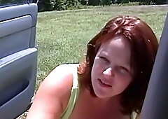 Busty redhead BBW nympho sucks cock outdoors