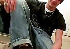 A twink shows off his feet as he plays with his dick