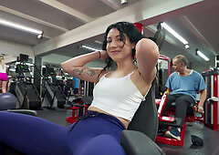Tattooed MILF sucks cock and rides reverse on gym floor