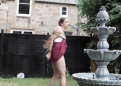 Serf Mila hasn’t kept up with her exercise routine, so u drag her to the garden fountain and binds her to it like a slothful pet. White All-Star sne