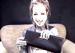 Happy to receive a new stainless-steel dildo from a fan, Anuskatzz is going to stick it inside both of her tattooed holes. She starts with her pussy a