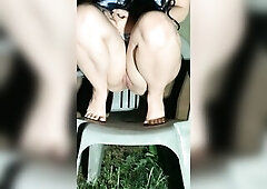 Angel lifts up costume to void urine on chair