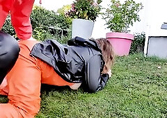 Squirting unfathomable in wife's twat wearing rainwear in the garden