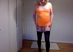 Orange minidress and black hold up stockings