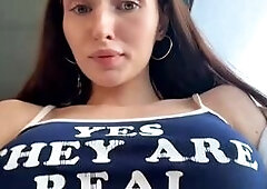 Brunette Shows Natural Assets on Train