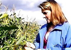 See this experienced whore push a thick, textured corn cob unfathomable into her stretched, clenching cunt in the midst of a field, her face twisting 