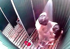 Sexy couple kissing in the beach shower