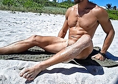 Athletic guy Andrearmani shows off his smooth bubble butt while doing nude yoga at a Rio beach