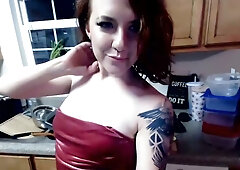 Tattooed redhead spreads herself open on webcam in the kitchen
