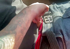 Amanda gives a gripping roadside handjob to a man in a red shirt on the interstate