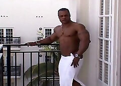 Silvio Samuel Flexing and Posing On A Balcony