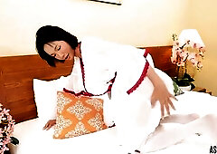 Solo East Oriental trans gal in sheer white babydoll and nylons teases and pleasures herself on the daybed, showing off her body and private moments i