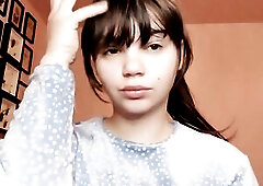 Brunette hair with natural large lips with natural color lipgloss smokin' a cigarette blowing smoke in your face